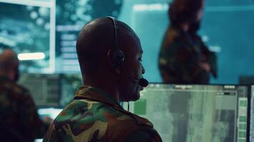 Telecommunications operator transmitting live information from satellite CCTV footage, supporting field troops with essential data. Federal agency working on reconnaissance system. Camera A. video