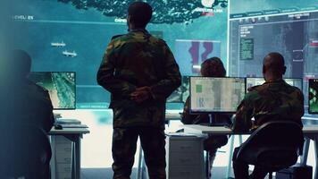 Military unit leader conducts reconnaissance operation to gather data and support troops in the field. Uses command center gear to provide crucial information, federal satellite radar. Camera A. video