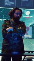 Vertical Army superior officers creating an attack plan using a hologram to gather real time information, working together to ensure national safety in a command center. Military operations. Camera A. video