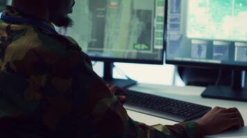 Soldier implements and processes tactical data with reconnaissance radar system, creating comprehensive battlefield maps to aid troops in the operational field. Intelligence for a mission. Camera A. video