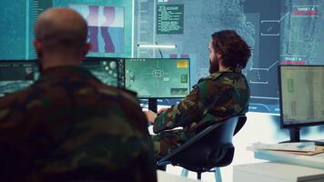 Diverse team of navy operators gather intelligence for future field missions, providing important information from CCTV satellite surveillance. Coordinating joint operations and strategies. Camera A. video
