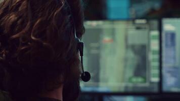 Commander communicating with allied forces and transmitting data from surveillance footage, coordinating joint operations and strategies to accomplish mission. Satellite radar operator. Camera A. video