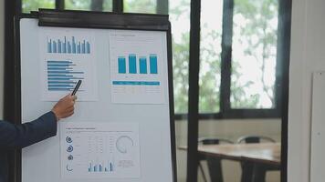 Financial analysts analyze business financial reports on a digital tablet planning investment project during a discussion at a meeting of corporate showing the results of their successful teamwork. video