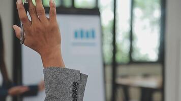 Financial analysts analyze business financial reports on a digital tablet planning investment project during a discussion at a meeting of corporate showing the results of their successful teamwork. video