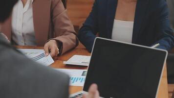 Financial analysts analyze business financial reports on a digital tablet planning investment project during a discussion at a meeting of corporate showing the results of their successful teamwork. video