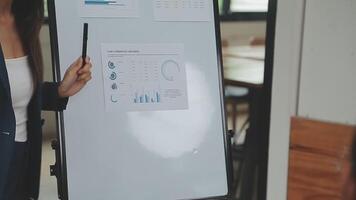 Financial analysts analyze business financial reports on a digital tablet planning investment project during a discussion at a meeting of corporate showing the results of their successful teamwork. video