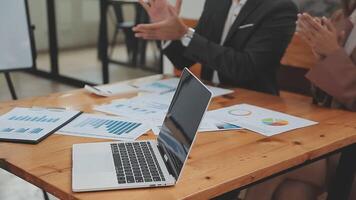 Financial analysts analyze business financial reports on a digital tablet planning investment project during a discussion at a meeting of corporate showing the results of their successful teamwork. video