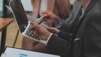 Financial analysts analyze business financial reports on a digital tablet planning investment project during a discussion at a meeting of corporate showing the results of their successful teamwork. video