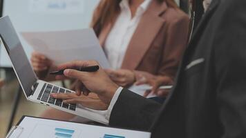 Financial analysts analyze business financial reports on a digital tablet planning investment project during a discussion at a meeting of corporate showing the results of their successful teamwork. video