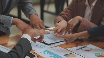 Financial analysts analyze business financial reports on a digital tablet planning investment project during a discussion at a meeting of corporate showing the results of their successful teamwork. video
