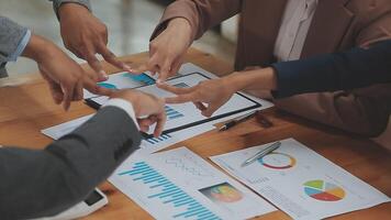 Financial analysts analyze business financial reports on a digital tablet planning investment project during a discussion at a meeting of corporate showing the results of their successful teamwork. video
