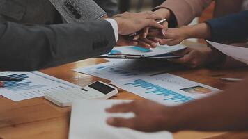 Financial analysts analyze business financial reports on a digital tablet planning investment project during a discussion at a meeting of corporate showing the results of their successful teamwork. video