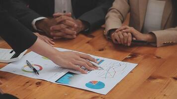 Financial analysts analyze business financial reports on a digital tablet planning investment project during a discussion at a meeting of corporate showing the results of their successful teamwork. video