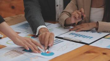Financial analysts analyze business financial reports on a digital tablet planning investment project during a discussion at a meeting of corporate showing the results of their successful teamwork. video