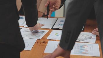 Financial analysts analyze business financial reports on a digital tablet planning investment project during a discussion at a meeting of corporate showing the results of their successful teamwork. video