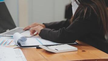 Financial analysts analyze business financial reports on a digital tablet planning investment project during a discussion at a meeting of corporate showing the results of their successful teamwork. video