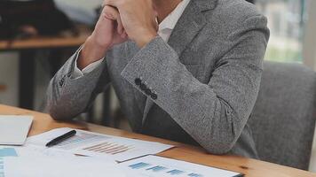 Financial analysts analyze business financial reports on a digital tablet planning investment project during a discussion at a meeting of corporate showing the results of their successful teamwork. video