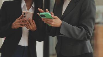 Financial analysts analyze business financial reports on a digital tablet planning investment project during a discussion at a meeting of corporate showing the results of their successful teamwork. video