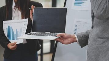 Financial analysts analyze business financial reports on a digital tablet planning investment project during a discussion at a meeting of corporate showing the results of their successful teamwork. video