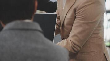 Financial analysts analyze business financial reports on a digital tablet planning investment project during a discussion at a meeting of corporate showing the results of their successful teamwork. video