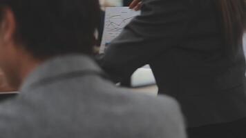 Financial analysts analyze business financial reports on a digital tablet planning investment project during a discussion at a meeting of corporate showing the results of their successful teamwork. video