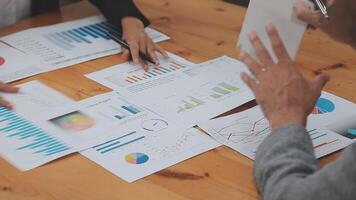 Financial analysts analyze business financial reports on a digital tablet planning investment project during a discussion at a meeting of corporate showing the results of their successful teamwork. video