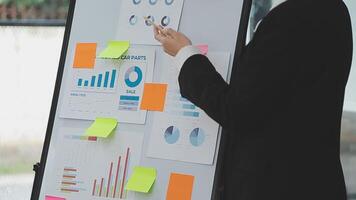 Financial analysts analyze business financial reports on a digital tablet planning investment project during a discussion at a meeting of corporate showing the results of their successful teamwork. video