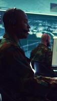 Vertical Telecommunications operator transmitting live information from satellite CCTV footage, supporting field troops with essential data. Federal agency working on reconnaissance system. Camera B. video