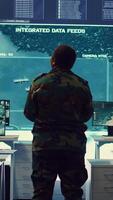 Vertical Woman colonel handling a special operation with big data in monitoring room, providing important satellite information to her crew in command post. Targeting enemy power base. Camera B. video