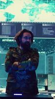 Vertical Army superior officers creating an attack plan using a hologram to gather real time information, working together to ensure national safety in a command center. Military operations. Camera B. video