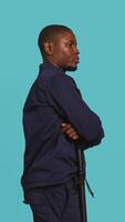 Vertical Portrait of security staff member tasked with evicting trespassers while following legal protocols. Patrolling agent maintaining secure environment, studio background, camera B video