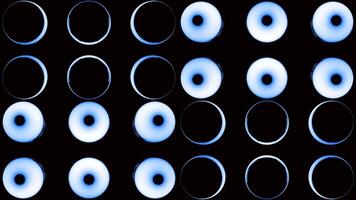 Bright lanterns.Design.A black background on which, in abstraction, bright green and blue sparkling circles with a bright light inside that changes. video
