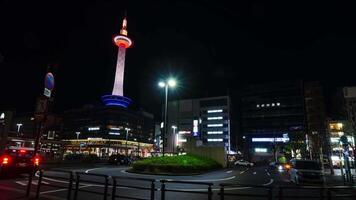 night timelapse view of street at arrival car platform infront of Tokyo station with kyoto tower highrise observation deck in night time video