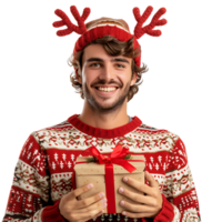 Happy smiling young man wearing red Christmas reindeer holding present on isolated transparent background png