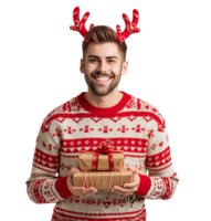 Happy smiling young man wearing red Christmas reindeer holding present on isolated transparent background png