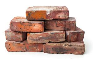A pile of old broken bricks on a white background. Generated by artificial intelligence photo
