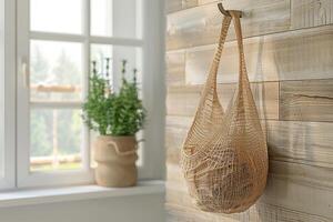 Mesh string bag hanging on a hook on a white wall with shadows. Generated by artificial intelligence photo