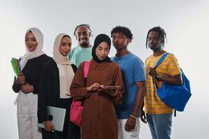 Group of diverse students engages in modern educational practices, utilizing a variety of technological tools such as laptops, tablets, and smartphones against a clean white background, exemplifying photo