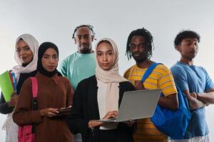 Group of diverse students engages in modern educational practices, utilizing a variety of technological tools such as laptops, tablets, and smartphones against a clean white background, exemplifying photo