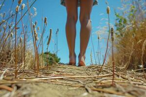 Women's bare feet in a wheat field. Generated by artificial intelligence photo