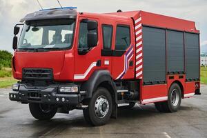 In this captivating scene, a state-of-the-art firetruck, equipped with advanced rescue technology, stands ready with its skilled firefighting team, prepared to intervene and respond rapidly to photo