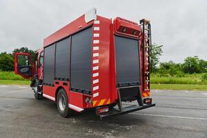 In this captivating scene, a state-of-the-art firetruck, equipped with advanced rescue technology, stands ready with its skilled firefighting team, prepared to intervene and respond rapidly to photo