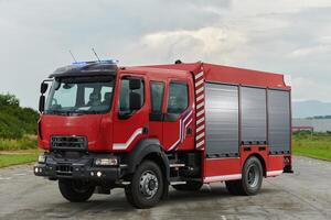 In this captivating scene, a state-of-the-art firetruck, equipped with advanced rescue technology, stands ready with its skilled firefighting team, prepared to intervene and respond rapidly to photo