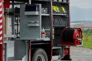 In this detailed close-up, a high-tech rescue tool, meticulously organized within state-of-the-art firefighting vehicles, showcases precision and innovation in life-saving equipment, emphasizing the photo