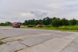 In this captivating scene, a state-of-the-art firetruck, equipped with advanced rescue technology, stands ready with its skilled firefighting team, prepared to intervene and respond rapidly to photo
