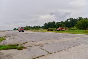 In this captivating scene, a state-of-the-art firetruck, equipped with advanced rescue technology, stands ready with its skilled firefighting team, prepared to intervene and respond rapidly to photo
