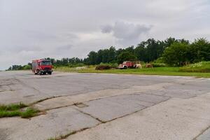 In this captivating scene, a state-of-the-art firetruck, equipped with advanced rescue technology, stands ready with its skilled firefighting team, prepared to intervene and respond rapidly to photo