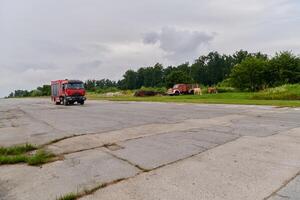 In this captivating scene, a state-of-the-art firetruck, equipped with advanced rescue technology, stands ready with its skilled firefighting team, prepared to intervene and respond rapidly to photo