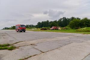 In this captivating scene, a state-of-the-art firetruck, equipped with advanced rescue technology, stands ready with its skilled firefighting team, prepared to intervene and respond rapidly to photo