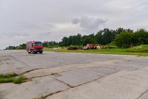 In this captivating scene, a state-of-the-art firetruck, equipped with advanced rescue technology, stands ready with its skilled firefighting team, prepared to intervene and respond rapidly to photo